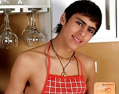 Charming twink with hairy uncut cock posing on a kitchen countertop in his sexy barbecue apron