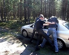 Big hunky dude blows two cocks and gets facialized outdoors